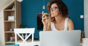 Female blogger writting a blog on laptop