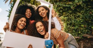 Young ladies posing for their social media post